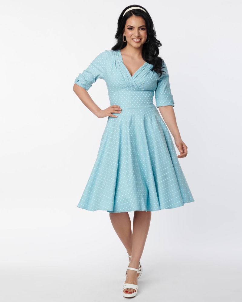 Front of a model wearing a size XL Unique Vintage Light Blue Pin Dot Delores Swing Dress in Blue, Polka Dot by Unique Vintage. | dia_product_style_image_id:300874